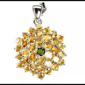 .925 slv w/ 14k white gld pt. Features diopside center stone adorned w citrine